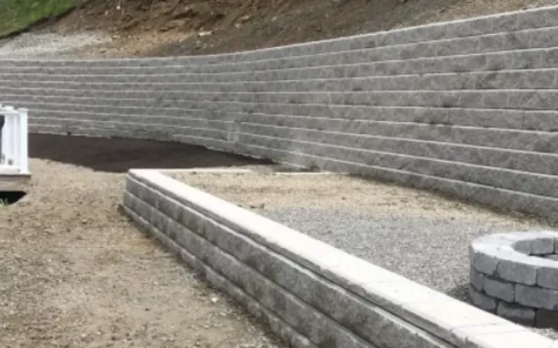 large two-tier retaining wall with second level fire pit